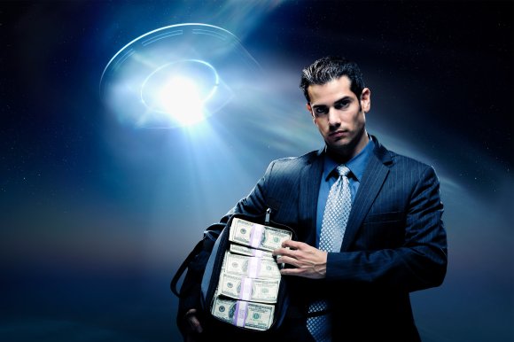 A former analyst at the UK central bank warned of apocalyptic financial scenarios if we ever confirm alien life.