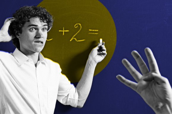 A young man with curly hair and a white shirt looks confused and bites his lip while holding a piece of chalk near a chalkboard. On the chalkboard, part of a math equation " + 2 =" is visible. In the foreground, a hand is raised showing four fingers. The background is stylized with a blue and yellow color scheme.