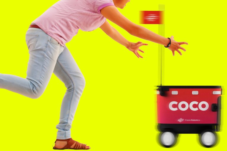 A person wearing light blue jeans, a pink and white striped shirt, and brown sandals is reaching out toward a small red delivery robot labeled "COCO" with "Coco Robotics" written below. The robot has four wheels and a small red flag on a pole. The background is bright yellow.