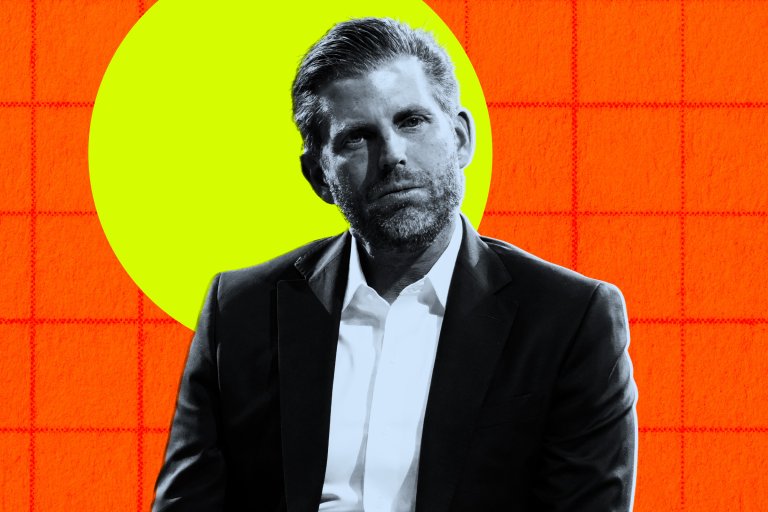 A black-and-white portrait of Eric Trump, wearing a dark suit jacket over a white shirt. The background features a bright yellow circle on an orange grid pattern.