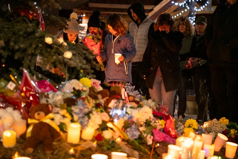 Community members mourn during a candlelight vigil for the victims of Tumbler Ridge Secondary School where a mass shooting took place a day earlier in the small town of Tumbler Ridge, British Columbia, on February 11, 2026.