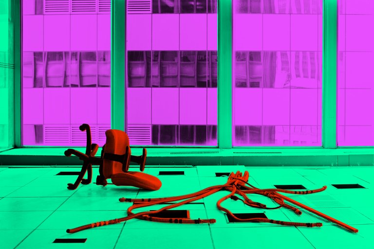 An overturned office chair and a bundle of cables or wires lie on a tiled floor in front of large windows. The image has been color-edited with the floor and window frames in bright green, the windows in purple, and the chair and cables in red-orange.
