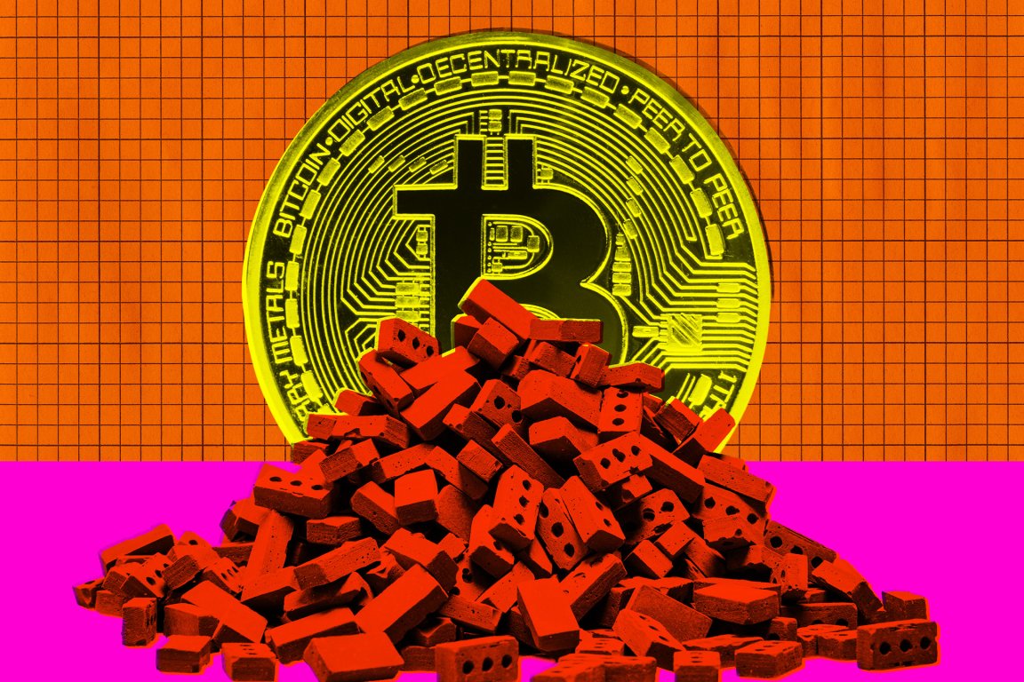 A large yellow Bitcoin coin with circuit-like details is positioned behind a pile of small red bricks. The background features an orange grid pattern on the upper half and a solid bright pink color on the lower half.