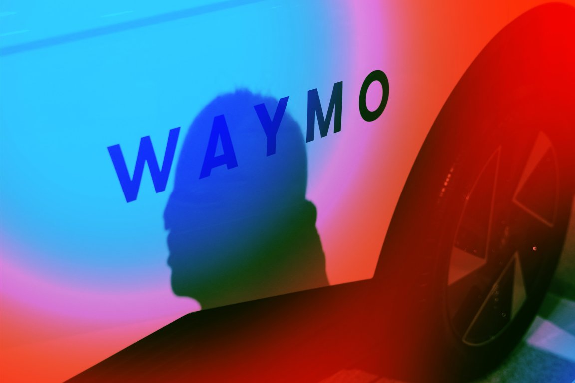 Shadow of a person's head cast on the side of a white vehicle with the word "WAYMO" written on it, featuring a colorful gradient of blue, pink, and red lighting. The vehicle's wheel is partially visible on the right side.