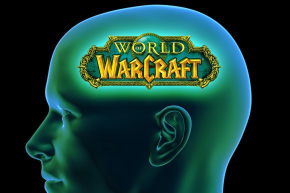 A translucent blue-green human head profile with the "World of Warcraft" logo prominently displayed inside the brain area, symbolizing the game occupying the person's mind. The background is black, emphasizing the glowing effect around the head and logo.