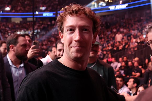 Mark Zuckerberg is shown at a sporting event.