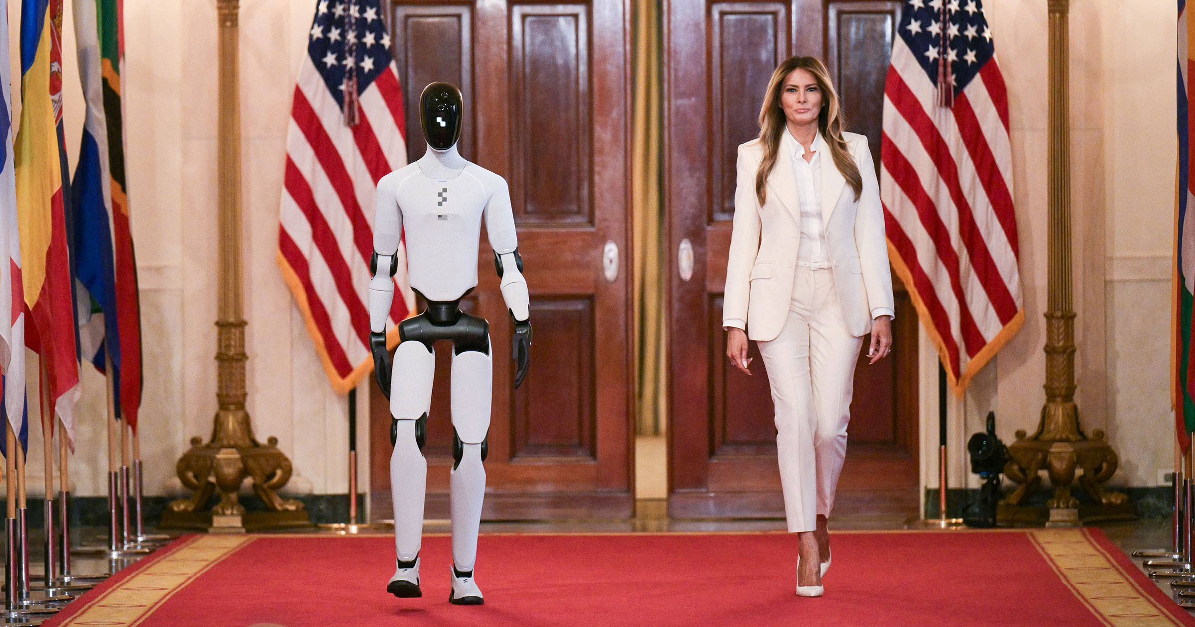 futurism.com - Victor Tangermann - Surreal Footage Shows Melania Trump Walking Into White House Summit With Humanoid Robot