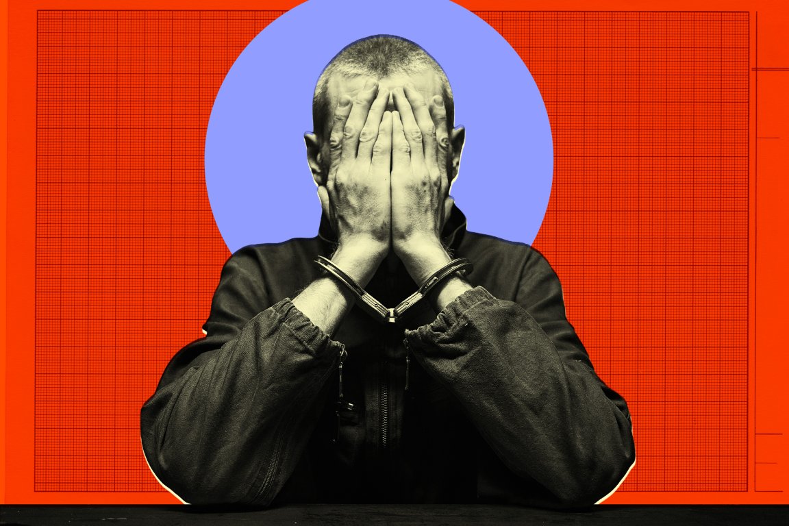 A person with short hair wearing a dark jacket is sitting with their hands covering their face. Their wrists are secured with handcuffs. The background features a large blue circle centered behind the person, set against a red backdrop with a grid pattern.
