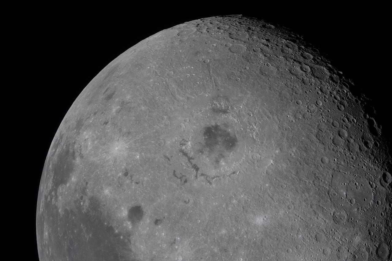 The crew got a perfect look at the Orientale basin, a "black patch of ancient lava in the center that punched through the Moon’s crust in an eruption billions of years ago," per NASA.