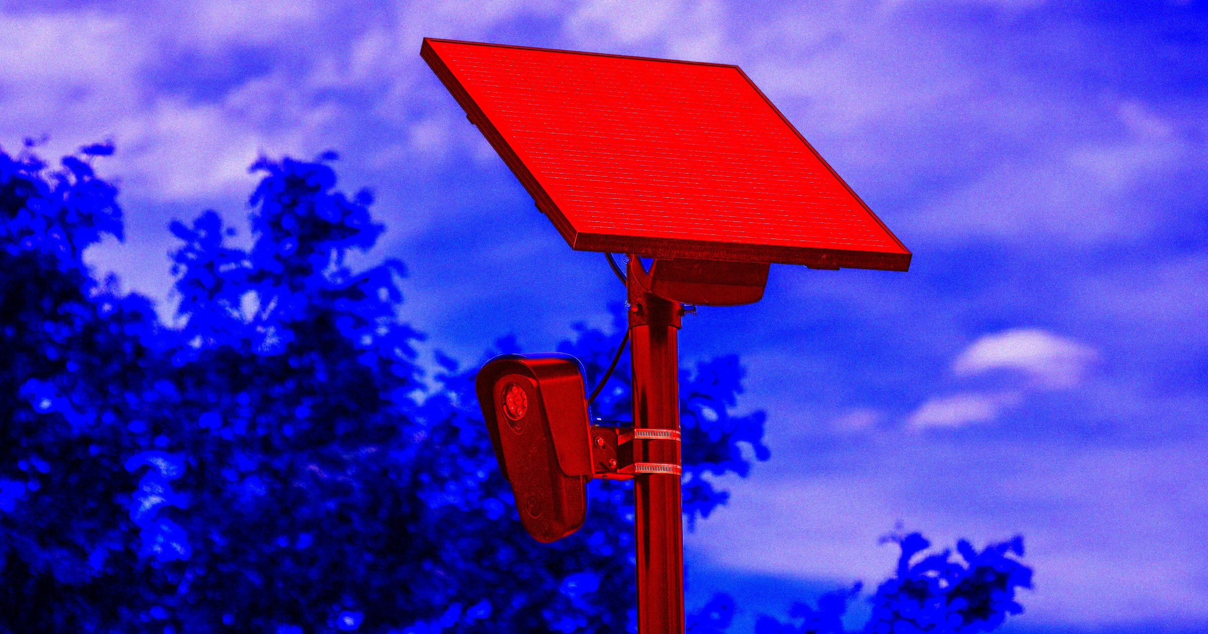 Police-mounted Flock Safety license plate reader camera on a street pole, used for automated vehicle tracking