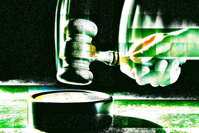 A hand holding a wooden judge's gavel poised above a round sound block, with a high-contrast, glitch-like effect in green and white tones.