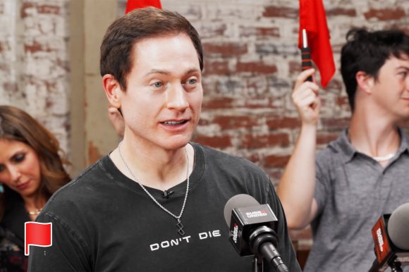 A screenshot from YouTube featuring Biohacker Bryan Johnson wearing a "Don't Die" t-shirt.