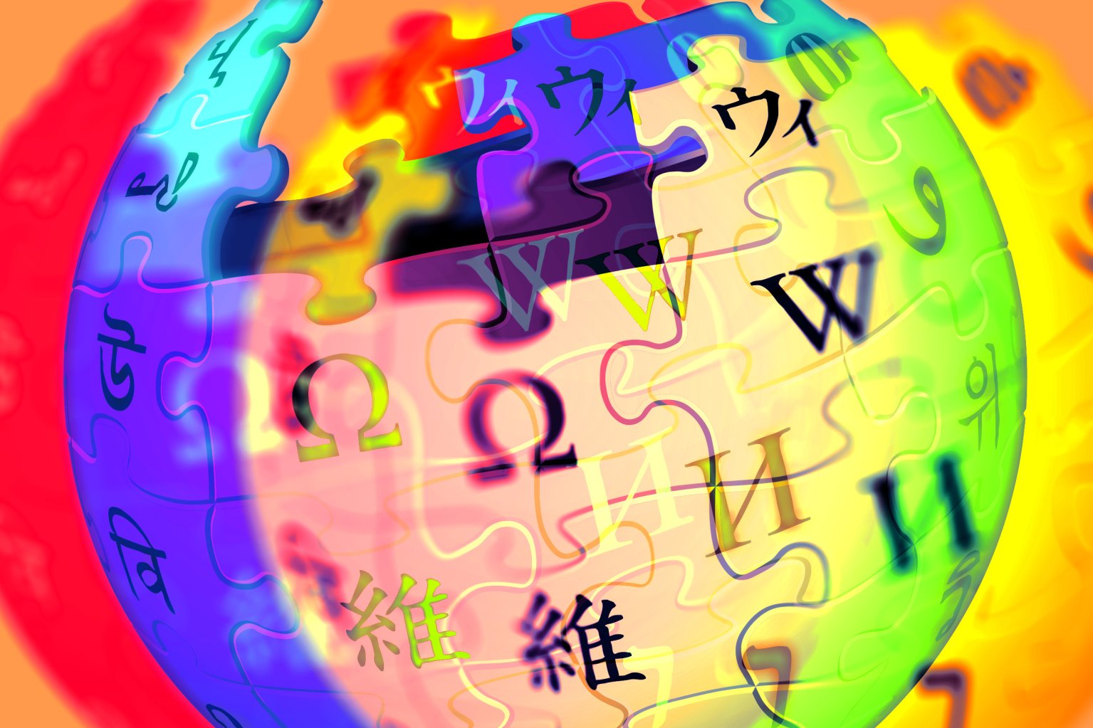 A colorful, abstract rendition of the Wikipedia globe logo, featuring puzzle pieces with various letters and characters from different writing systems. The image has a vibrant gradient background with red, orange, yellow, green, blue, and purple hues blending together. The puzzle pieces and letters appear slightly distorted and layered, creating a dynamic and artistic effect.