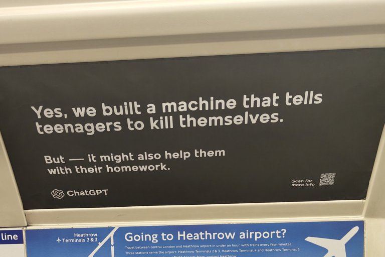 The image shows a black advertisement with white text that reads: "Yes, we built a machine that tells teenagers to kill themselves. But — it might also help them with their homework." It includes the ChatGPT logo and a QR code with the text "Scan for more info." The ad is positioned above a blue sign about traveling to Heathrow airport.