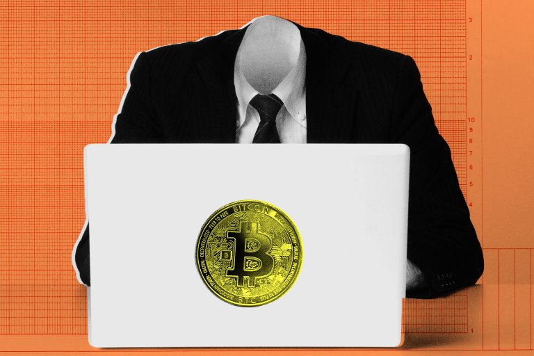 A faceless person in a black suit and tie is sitting behind a white laptop with a large yellow Bitcoin symbol on it, set against an orange background with a grid pattern.