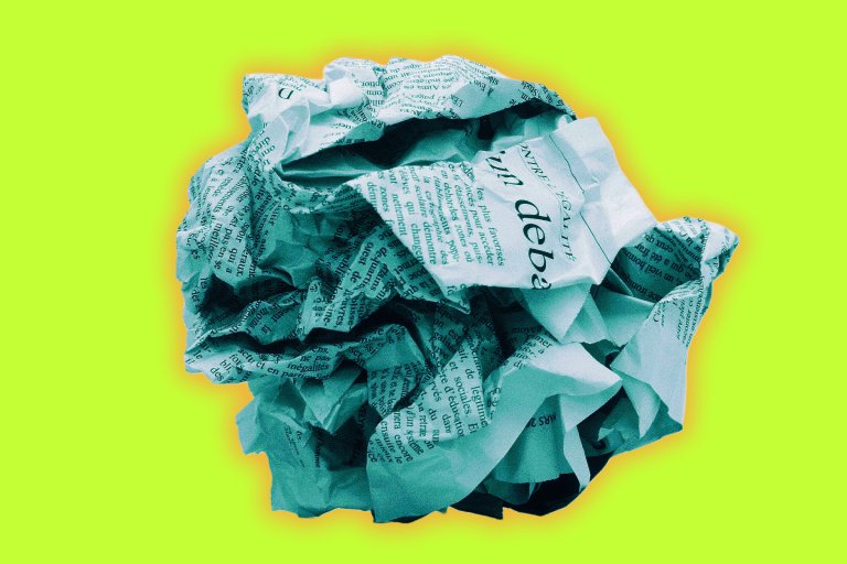 A crumpled piece of newspaper with visible text in French, set against a bright lime green background with a subtle orange glow around the paper.