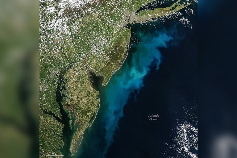 Satellite view of the mid-Atlantic region of the United States, showing a blue-green swirl pattern.