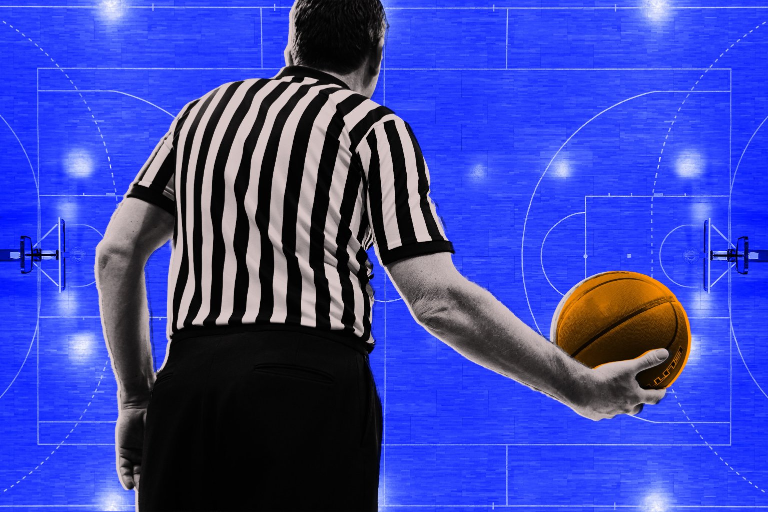 A basketball referee shown from behind holding a basketball in his right hand over a field of blue.