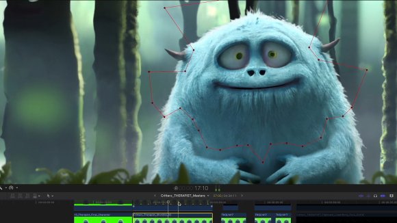 A fluffy blue animated creature with small horns and large, round eyes is standing in a misty forest.