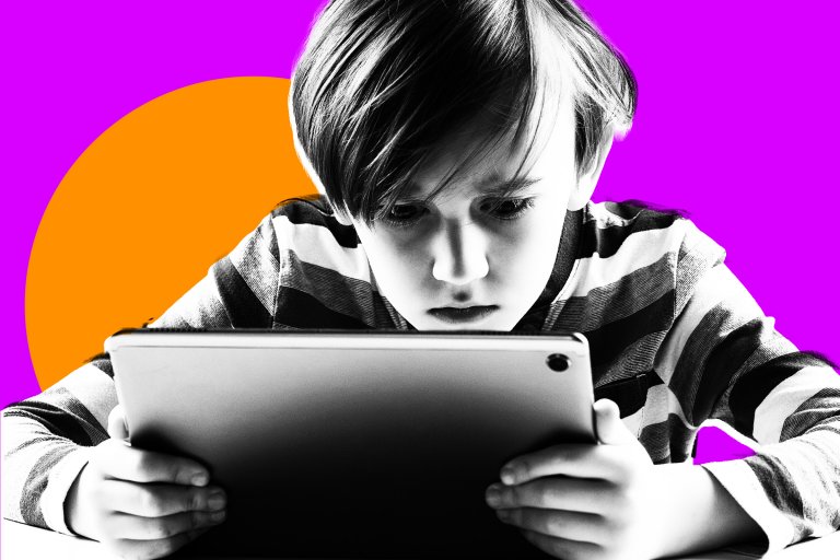 A focused young boy with short hair wearing a striped long-sleeve shirt is holding and looking intently at a tablet. The image is in black and white, with a vibrant purple background and an orange circle behind the boy.
