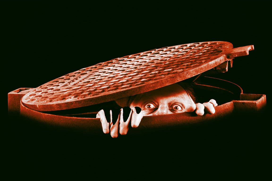 Illustration of a strange man emerging from beneath a manhole cover, eyes peeking out of the dark.