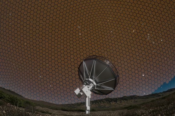 A screenshot of a video depicting a radio telescope as it scans the sky, depicted as a honeycomb pattern.