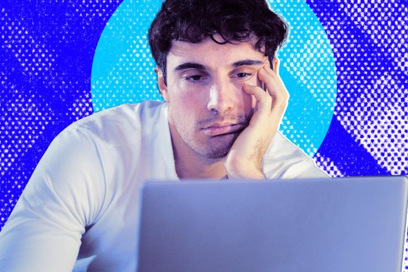A stylized photo illustration of a man looking at his laptop with a sad, mournful expression.