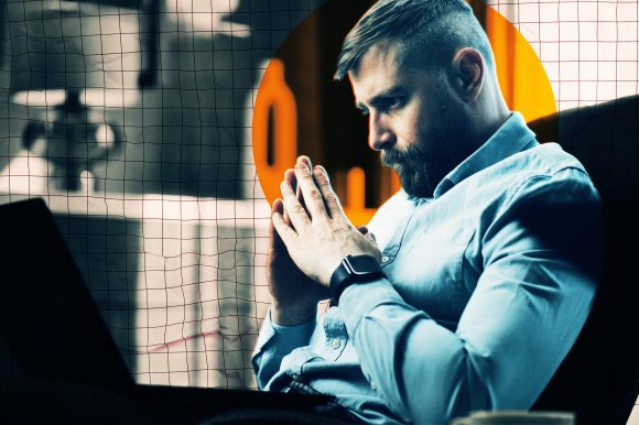 A photo illustration featuring a thirty-something man watching his laptop with his hands folded and a disappointed expression.