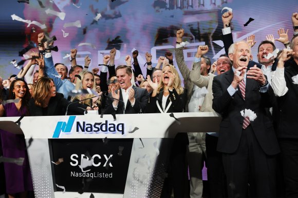SpaceX President Gwynne Shotwell celebrates with family and other SpaceX employees at the Nasdaq Marketsite in Times Square during the launch of the SpaceX initial public offering (IPO) on the Nasdaq.