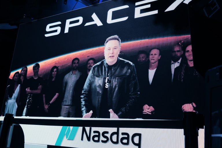 Elon Musk, founder and CEO of SpaceX, speaks via video before the ringing of opening bell at the Nasdaq Marketsite at the launch of the company's initial public offering.