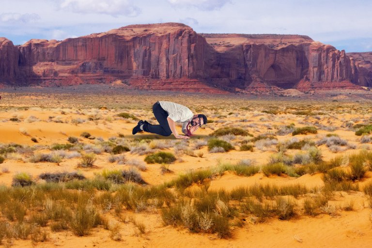 A comic illustration featuring a man in the Utah desert listening for rumbles in the ground.