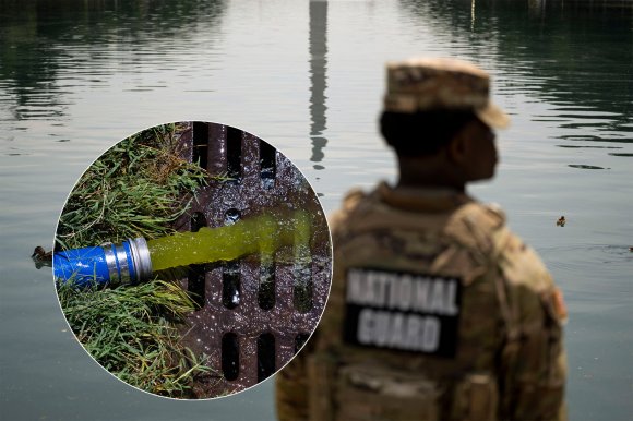 A National Guard soldier in camouflage uniform stands near a body of water with ducks swimming. An inset shows a close-up of a blue hose discharging yellow-green liquid into a metal grate surrounded by grass.