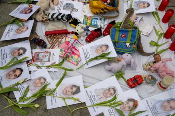 Portraits commemorating the girls who died in the bombing of a girls' school in Iran.