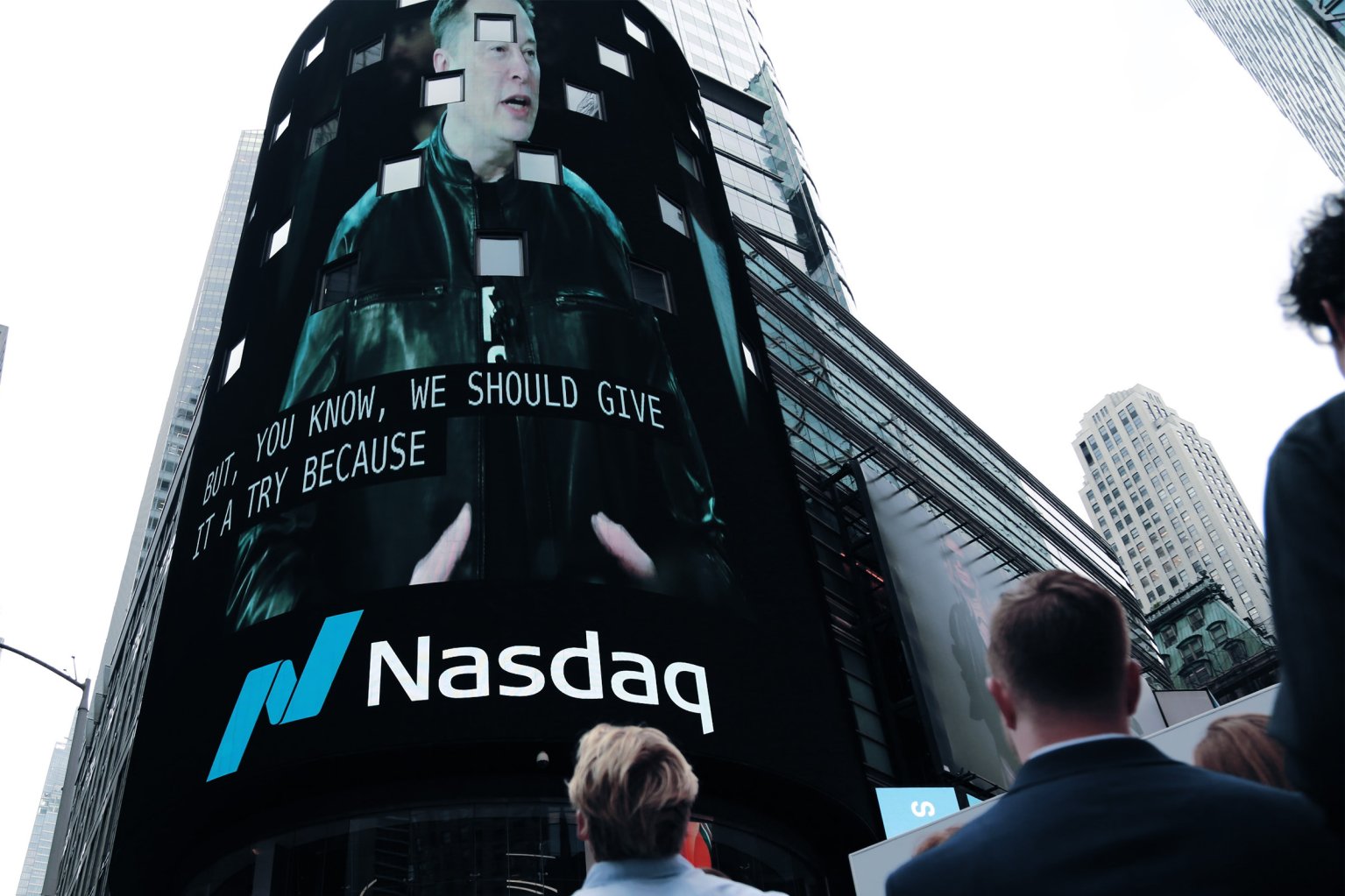 People watch the IPO ceremony of SpaceX outside the Nasdaq building in Times Square in New York City.