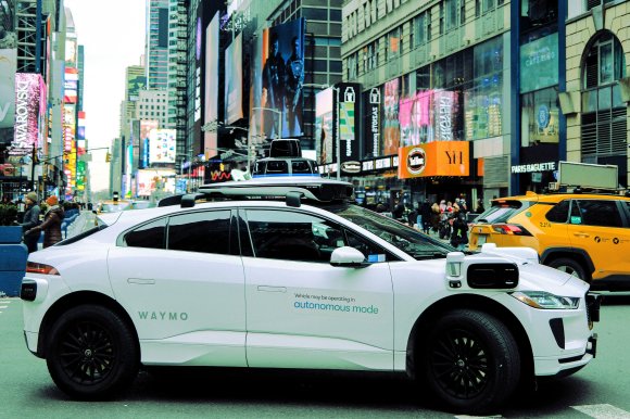 A Waymo autonomous self-driving Jaguar electric vehicle is seen in the Manhattan borough of New York City, on December 13, 2025.