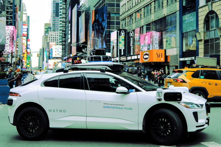A Waymo autonomous self-driving Jaguar electric vehicle is seen in the Manhattan borough of New York City, on December 13, 2025.