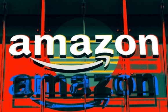 A stylized photo illustration of the Amazon Logo affixed to a building.