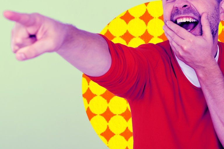 A photo illustration of a man pointing and laughing at something in a fit of mockery and schadenfreude.
