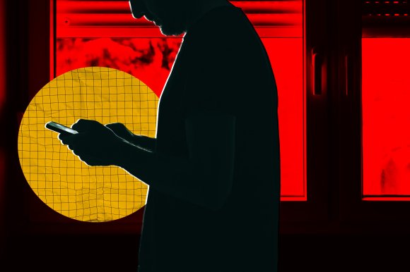 A photo illustration featuring the silhouette of a lonely man using his phone.