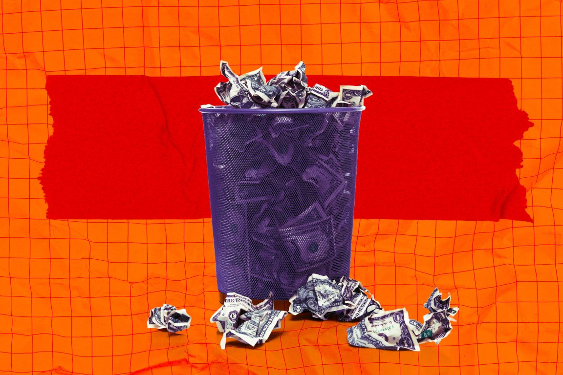 A photo illustration of a waste basket full of wadded up money.