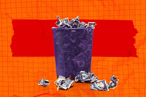 A photo illustration of a waste basket full of wadded up money.