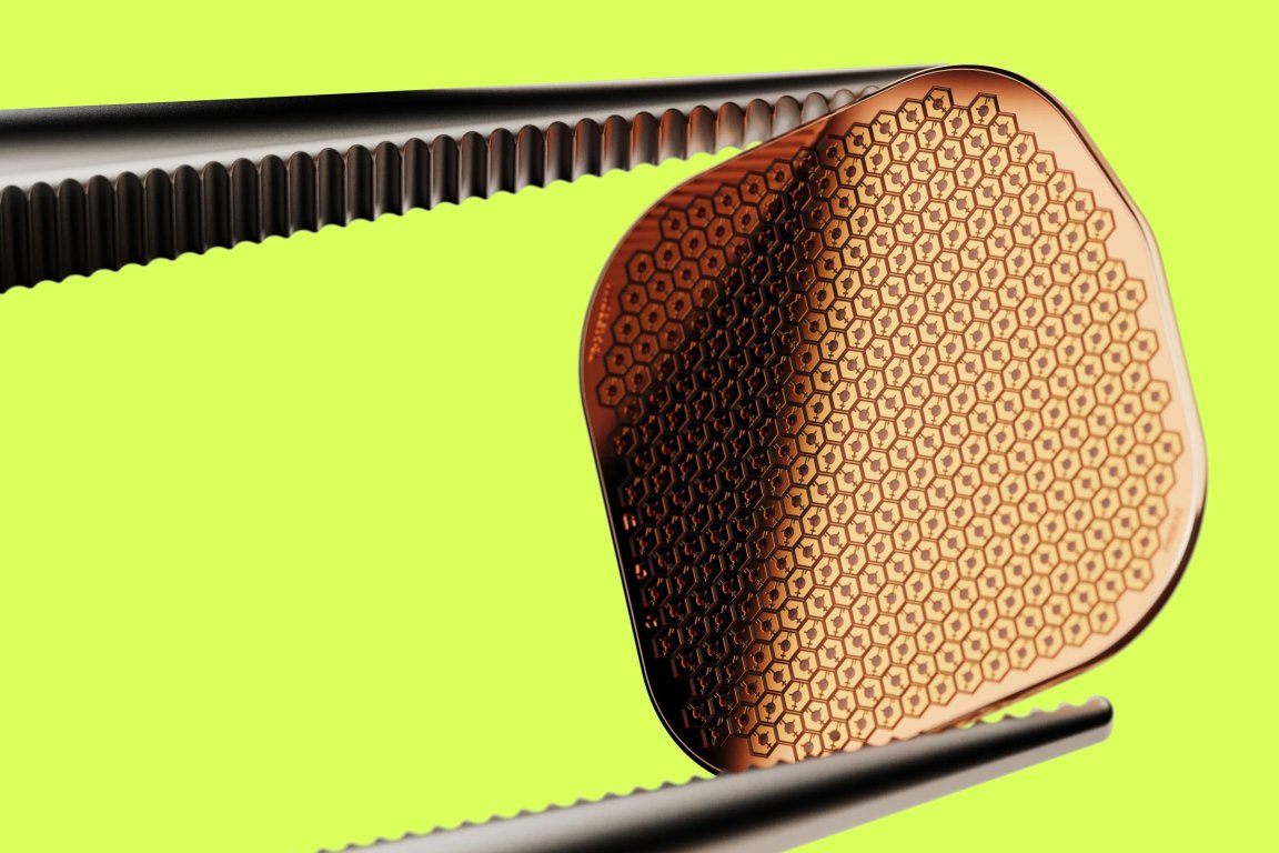 A high-definition close-up photograph of the eye implant chip.