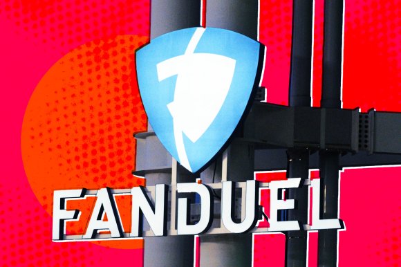 A photo illustration featuring a building with the FanDuel logo affixed to its exterior.