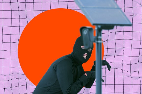 A photo illustration featuring a flock camera in the foreground while a thief in a balaclava sneaks behind it with a smile on his face.
