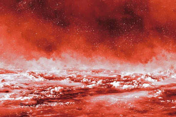 A color-treated close-up photograph of the surface of boiling water.
