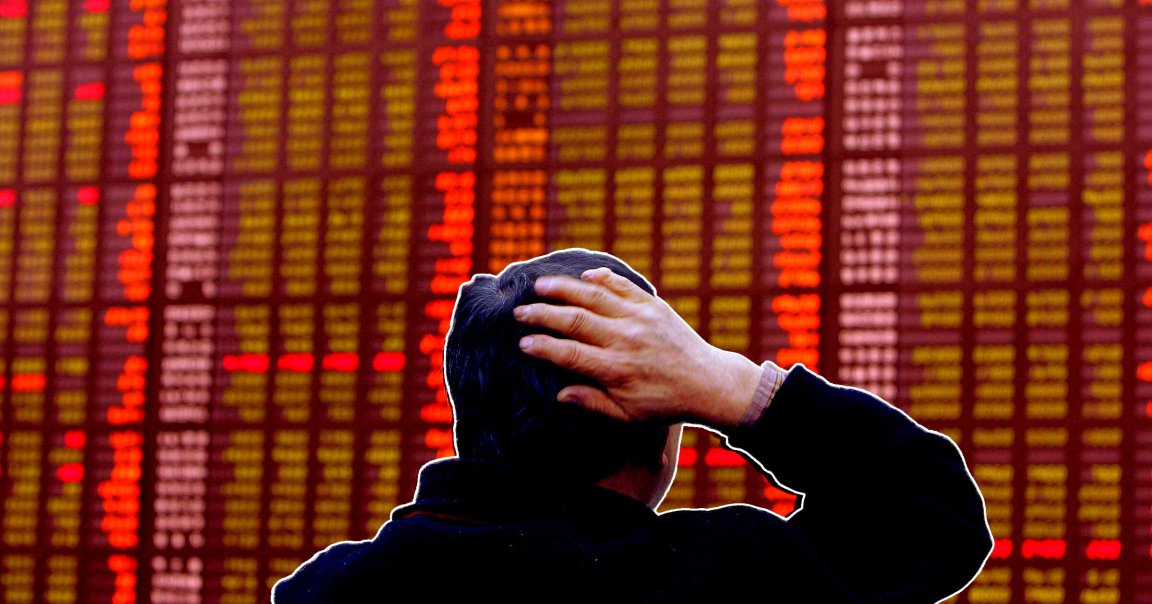 A photo illustration of a South Korean man watching a stock index board in Seoul.