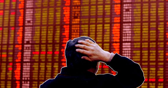 A photo illustration of a South Korean man watching a stock index board in Seoul.