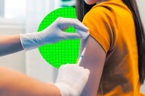 A person wearing an orange short-sleeve shirt is receiving an injection in the upper arm. A healthcare professional wearing white gloves is holding a syringe with one hand and a cotton ball on the injection site with the other hand. The background is blurred with a green circular grid pattern behind the arm.