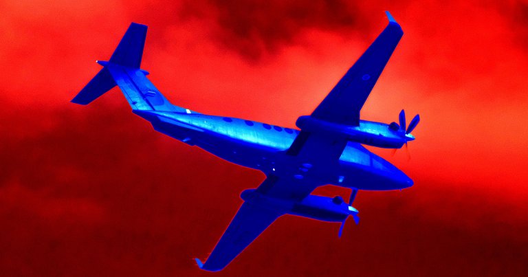 A color-treated photo of a twin-engine aircraft.