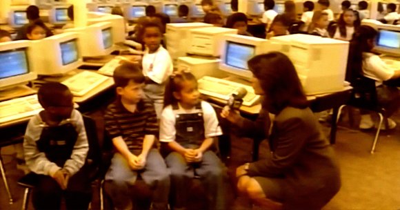 A screenshot of an AI-generated clip showing elementary school students in the '90s predicting how we'll use computers.